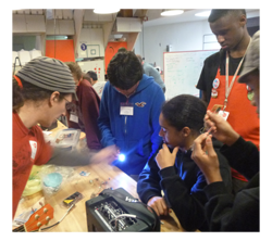 Drew Blanke testing circuit bent mod kits with children at NySci Queens